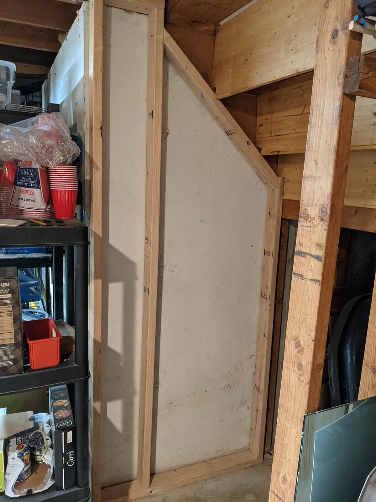 Starting to frame the wall under the stairs with 2x4 studs